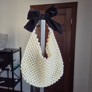 Elegant Pearl Beaded Handbag with Black Bow